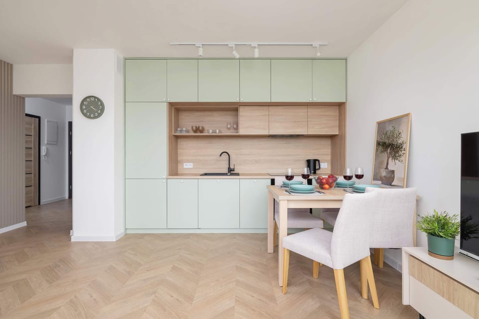 The kitchen and dining zone captured from a slightly different angle, emphasizing layout symmetry.