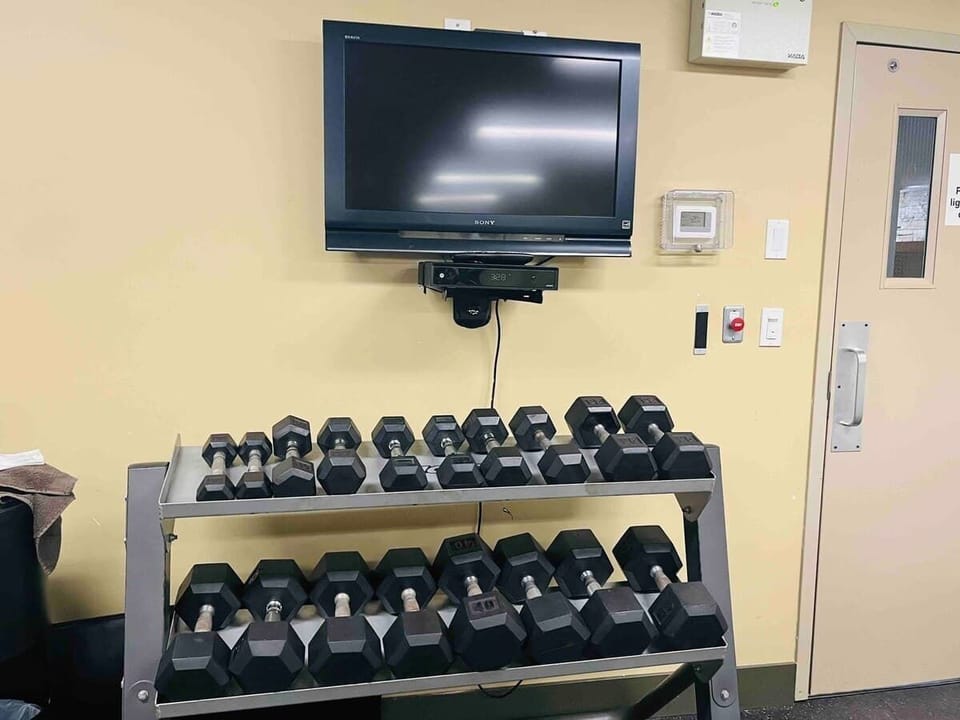 Burn off some energy, right here. Weights and entertainment.