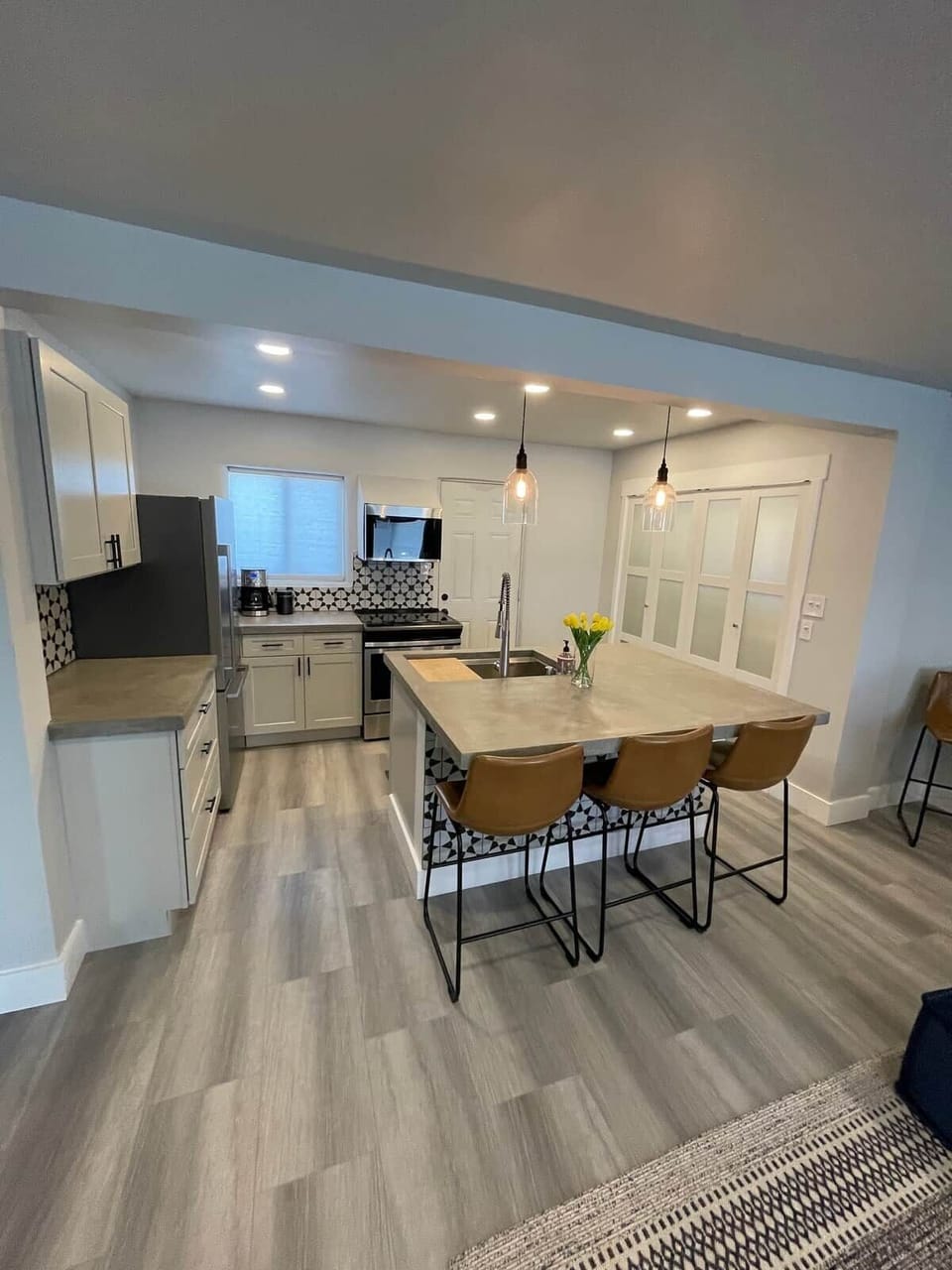 Brand new kitchen, with custom concrete island. Clean and open with everything you need!