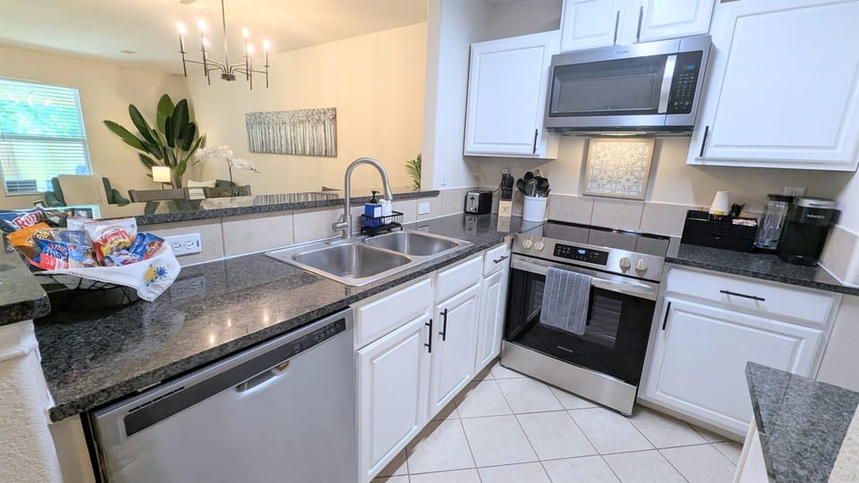 Cook up some family fun in this fully stocked kitchen complete with stove, oven, microwave, dishwasher, and fridge. 