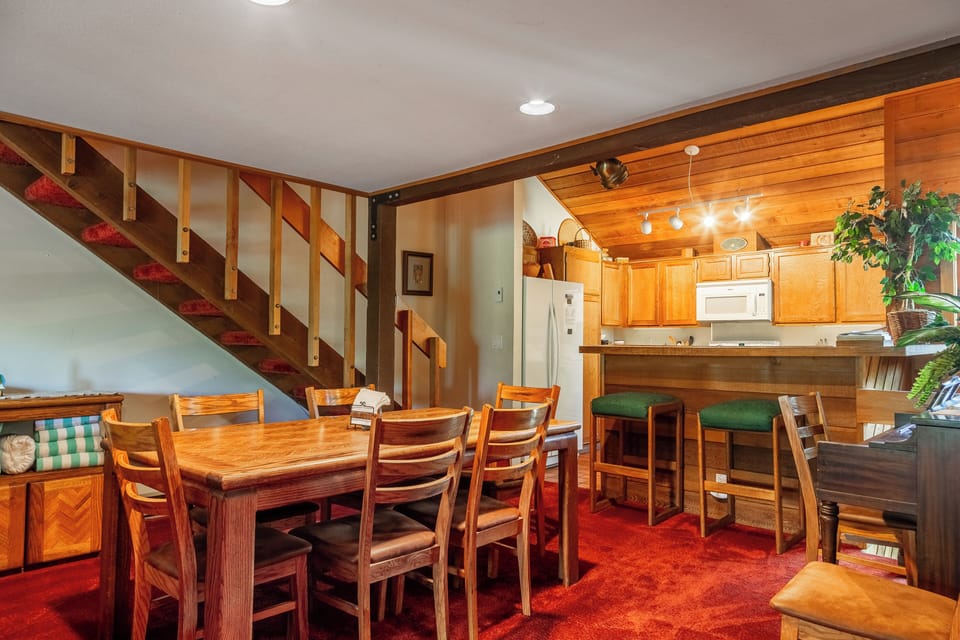Dining open to bar and kitchen.