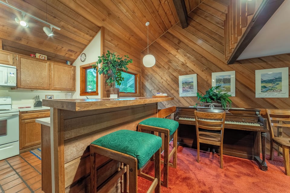 Bar seating in kitchen area.