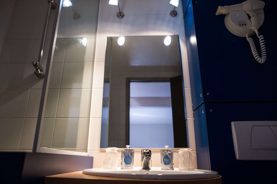 Bathtub, eco-friendly toiletries, hair dryer, towels