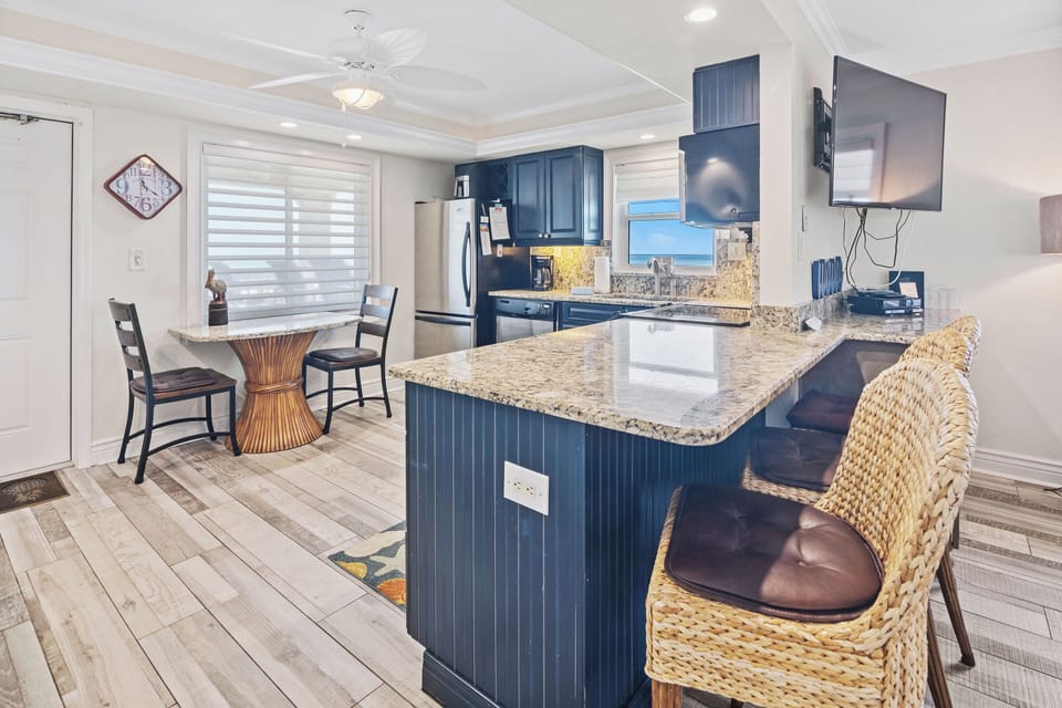 Savor your beach stay with a modern kitchen, granite countertops, and cozy breakfast nook. Enjoy meals or morning coffee while taking in refreshing ocean views from your seaside getaway.