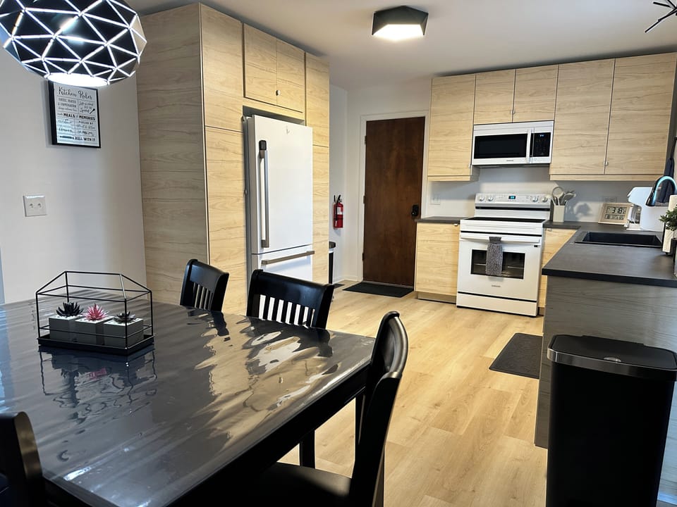 Eat-in kitchen with microwave, air fryer oven, dishwasher, stove, & fridge