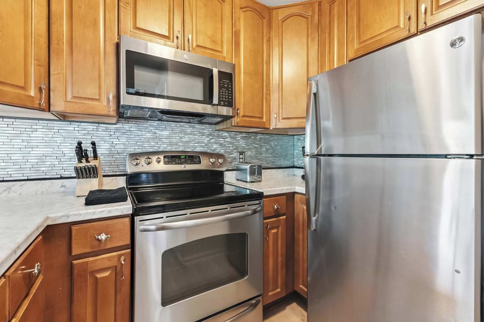 Kitchen: Main floor, drip coffee maker, toaster, cooking utensils, tableware