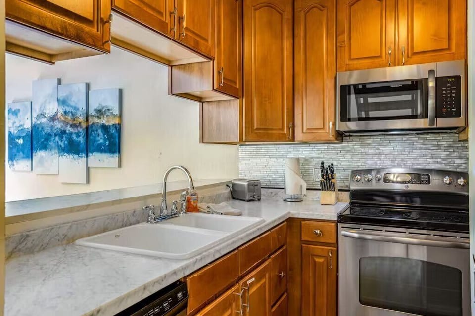 Kitchen: Main floor, drip coffee maker, toaster, cooking utensils, tableware