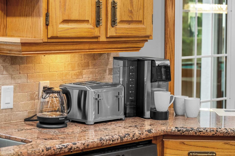 Kitchen stocked with essentials—coffee, cookware, more