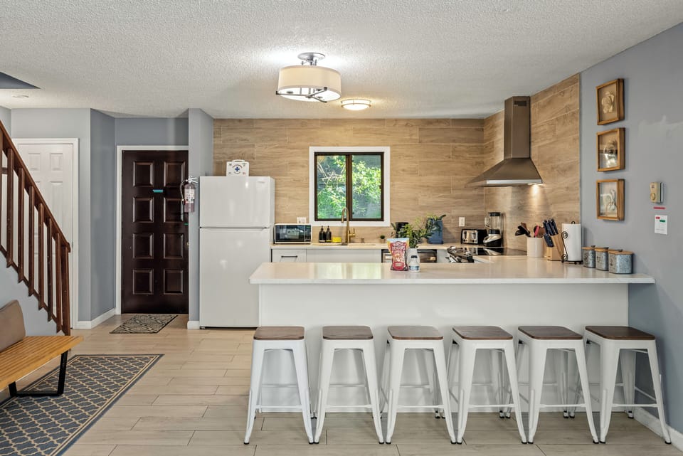Modern kitchen with barstool seating.