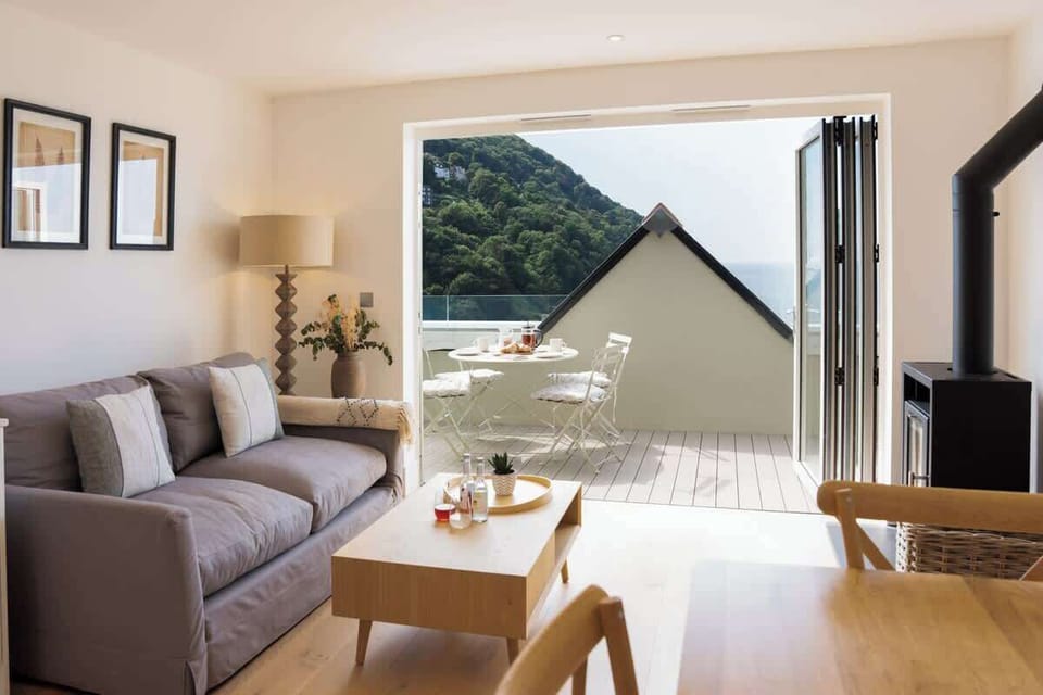 The spacious living room opens directly onto a private balcony, perfect for enjoying the fresh air and scenic views.