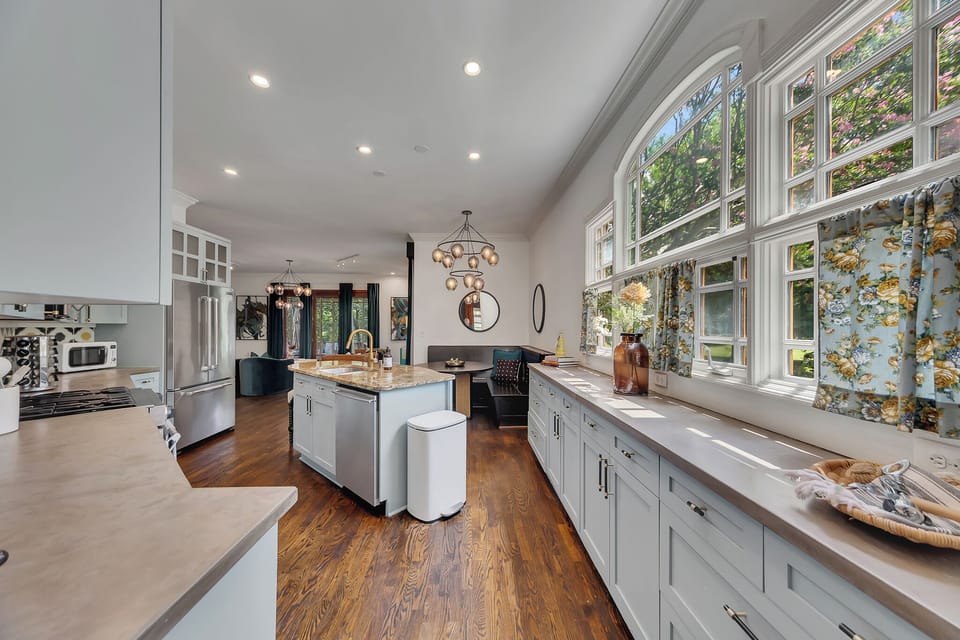 a built-in black banquette, and a striking globe chandelier.