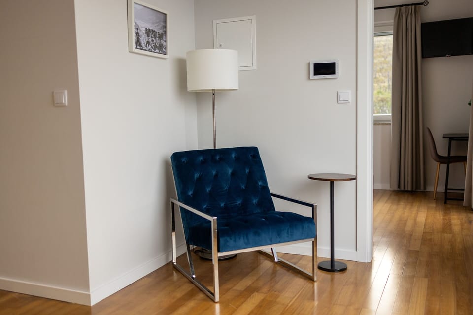 A stylish and comfortable armchair invites you to enjoy the mountain views. 