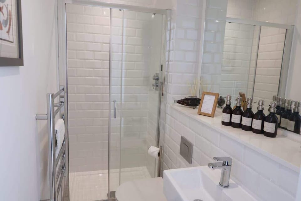 Indulge in the spacious bathroom, designed for comfort and relaxation with plenty of room to unwind.