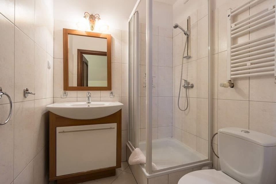 Quadruple Room, Garden View | Bathroom | Hair dryer, towels, soap, toilet paper