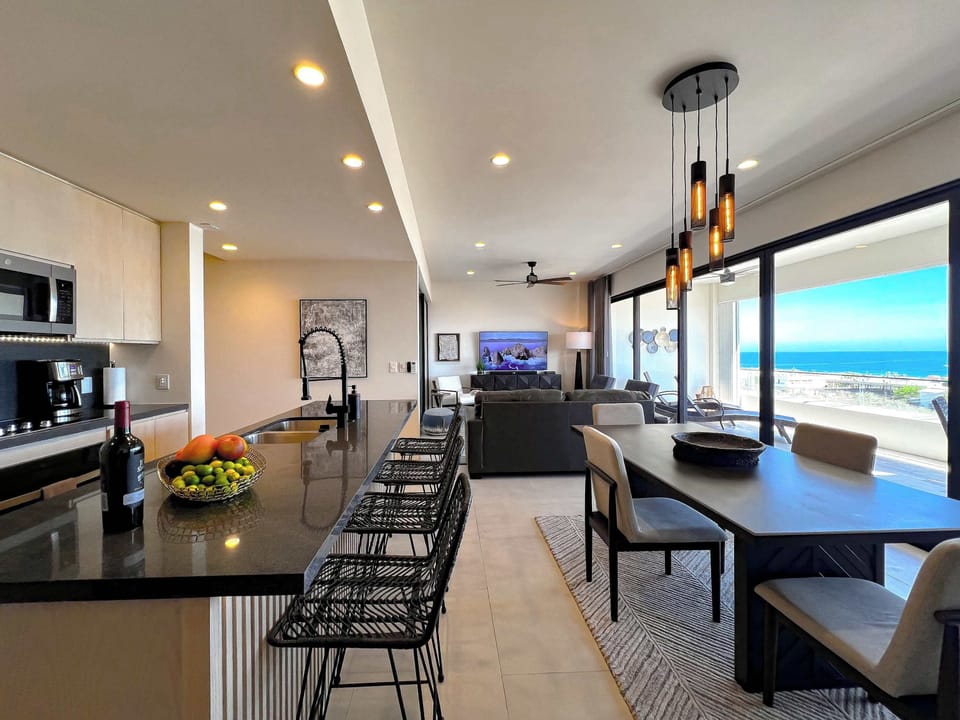 Open living space with dining area and ocean views.
