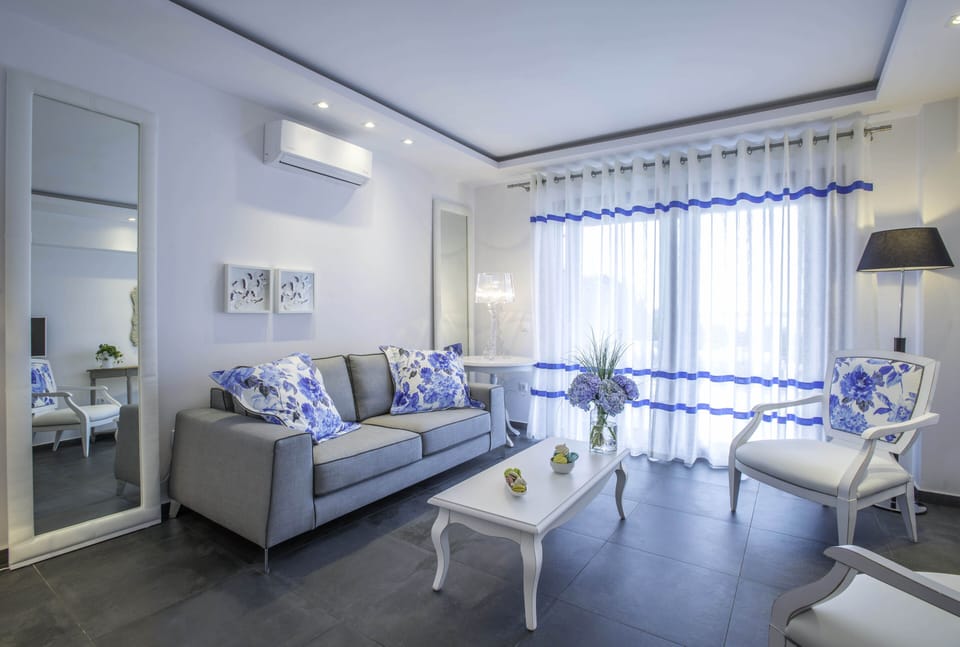 Two Bedroom Suite with Private Pool | Living area | 26-inch plasma TV with satellite channels, TV, toys