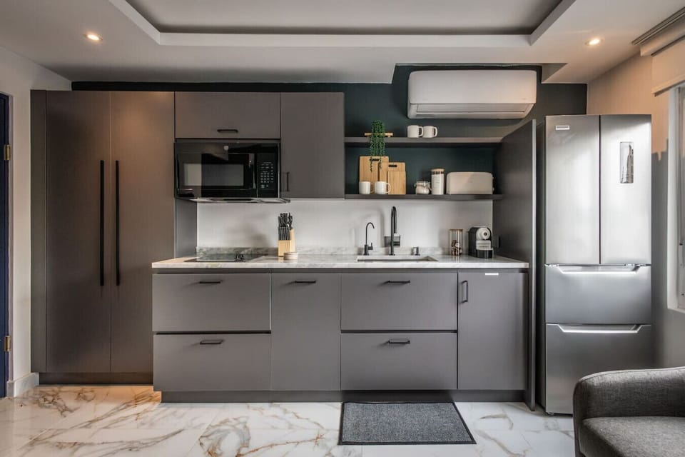 La Victoria, apartment style king bedroom with  sofa bed, dining area and kitchem