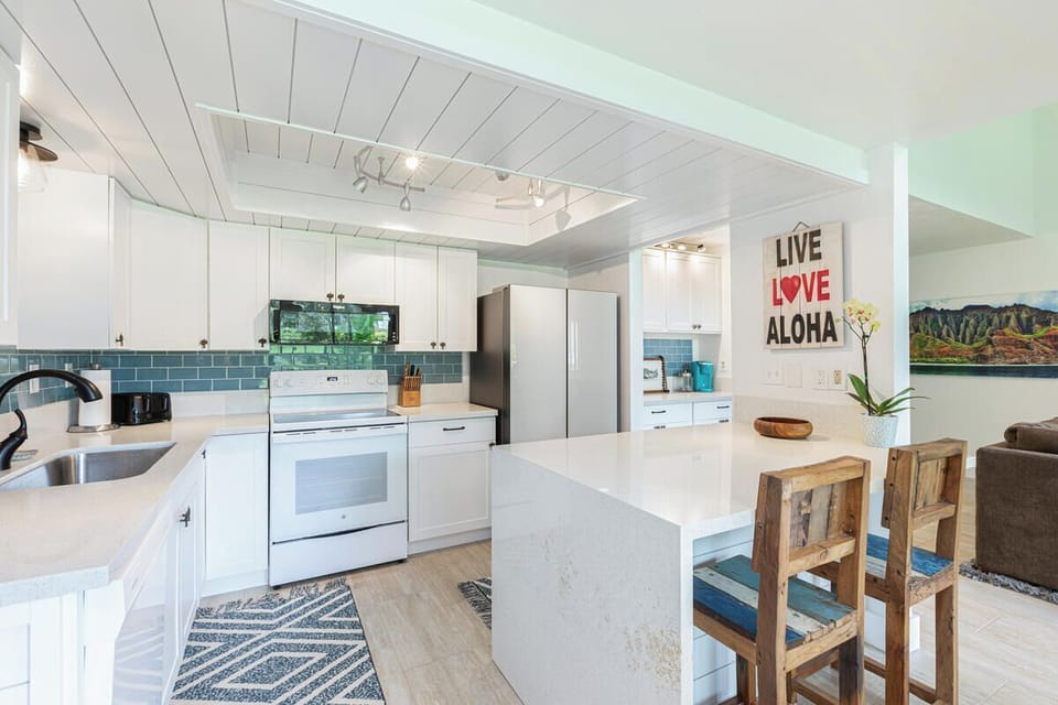 Chef-ready kitchen with bar seating and coffee station—perfect for group stays.