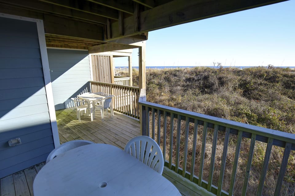 Savor morning coffee or evening sunsets on your cozy private balcony overlooking the lush surroundings.