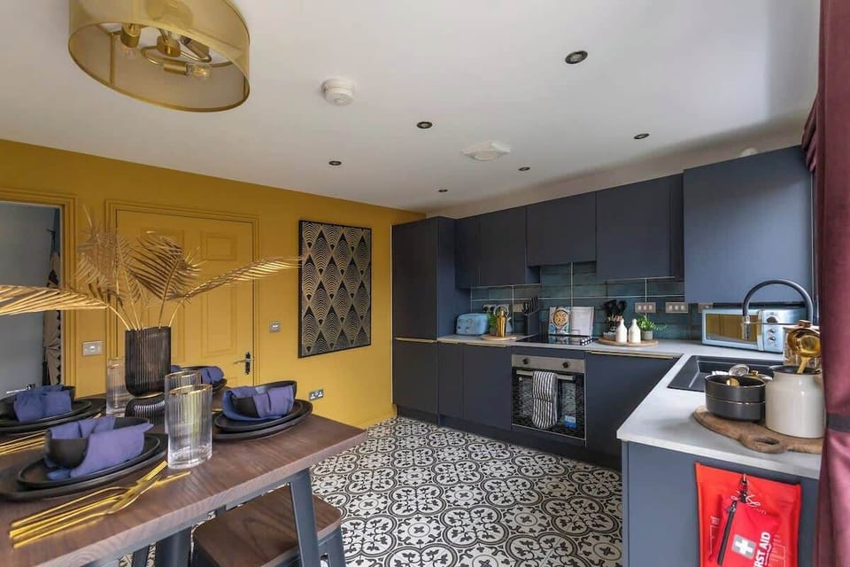 "Cook with ease in this clean, spacious kitchen featuring a sleek modern design and top-notch amenities."