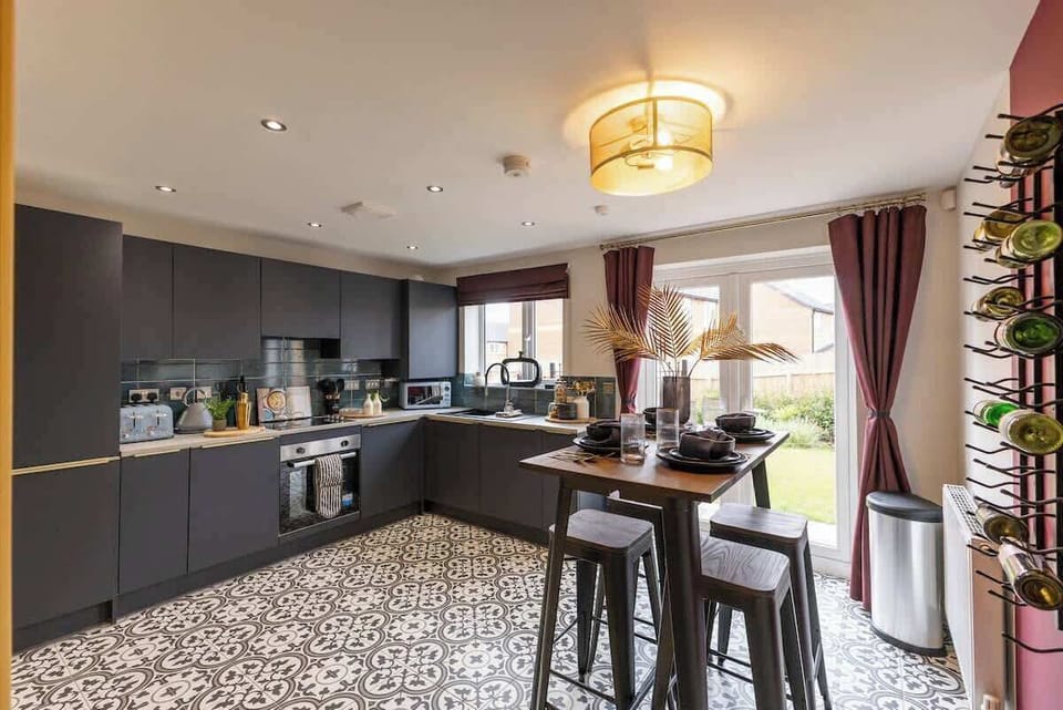 "Cook with ease in this clean, spacious kitchen featuring a sleek modern design and top-notch amenities."