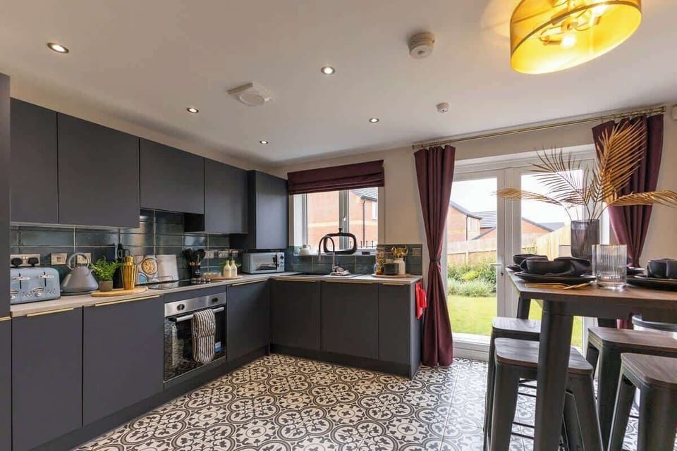 "Cook with ease in this clean, spacious kitchen featuring a sleek modern design and top-notch amenities."