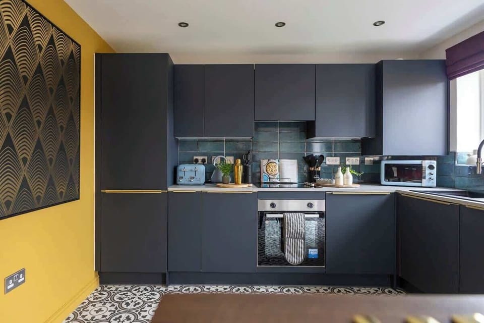 "Cook with ease in this clean, spacious kitchen featuring a sleek modern design and top-notch amenities."