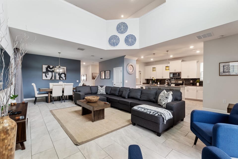 Living Room Area with TV, Dining Area & Kitchen in Back Ground