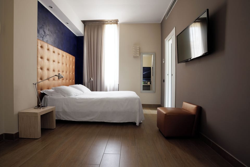 Double or Twin Room | Minibar, in-room safe, individually decorated, desk