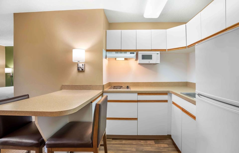 Deluxe Studio, 1 King Bed with Sofa bed, Non Smoking | Private kitchen | Full-size fridge, microwave, stovetop, coffee/tea maker