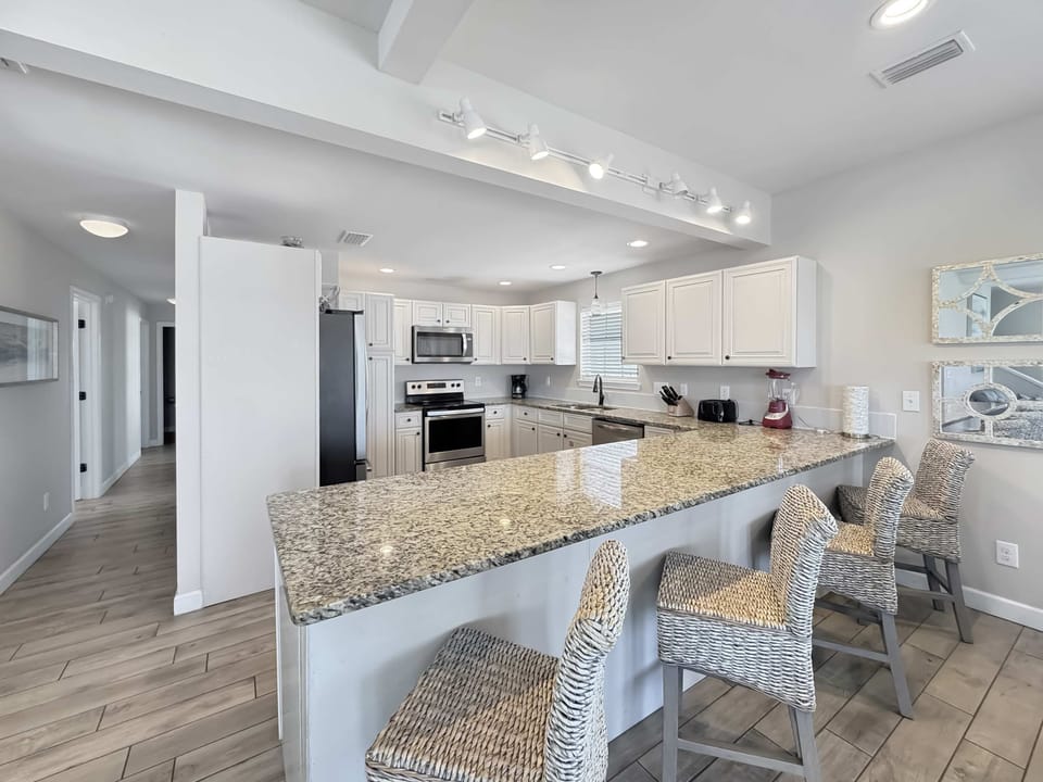 The open, airy kitchen offers ample space & every home comfort​