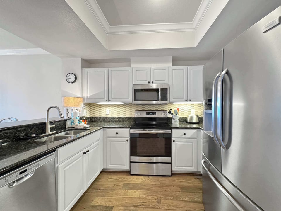 The open, airy kitchen offers ample space & every home comfort​