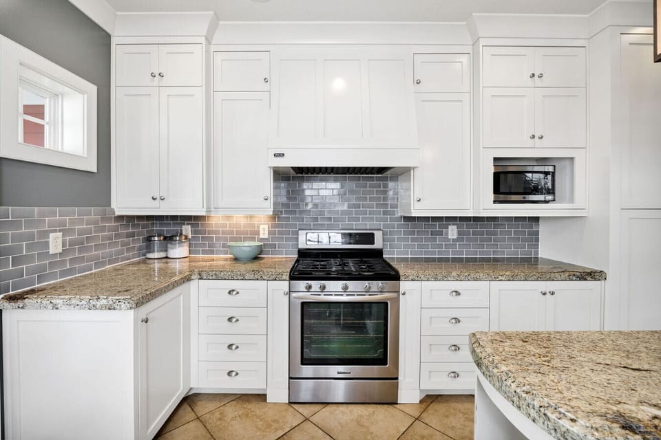 Enjoy the convenience of a fully stocked kitchen featuring sleek, modern appliances