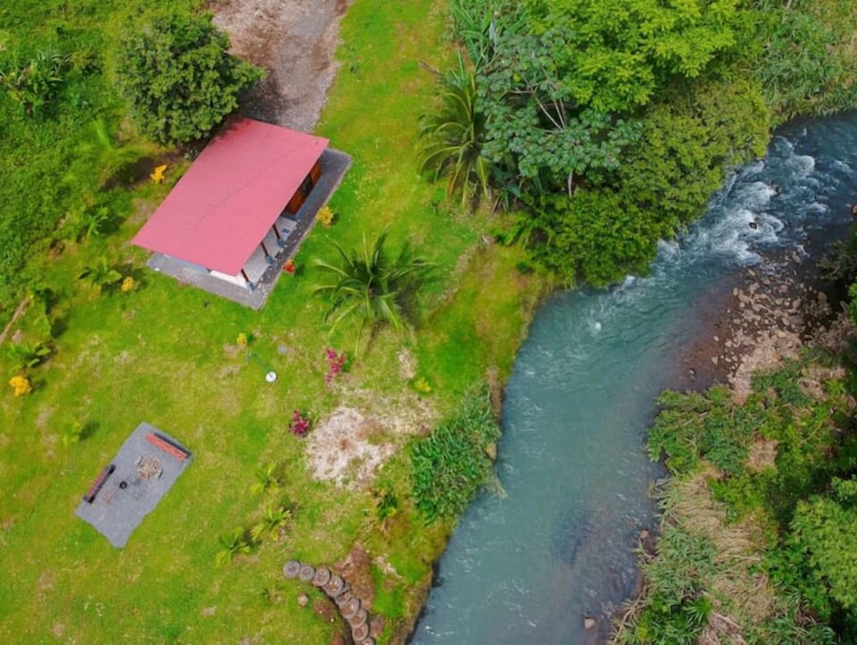 Peaceful river right in front of the cabin — perfect for swimming and relaxing.