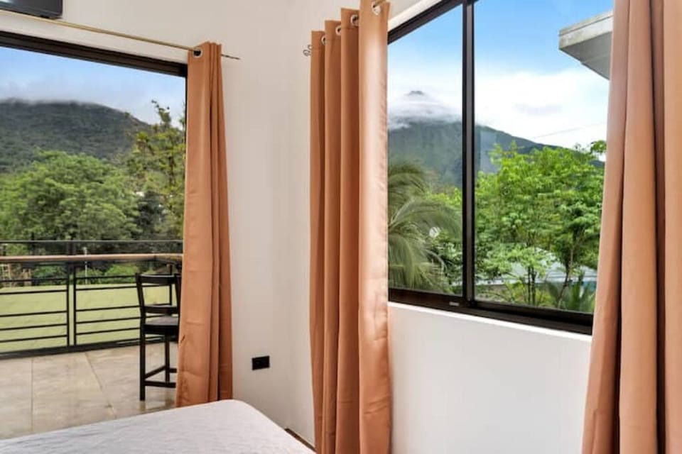Wake up to Arenal Volcano views, birdsong, and a hot coffee in serene nature.