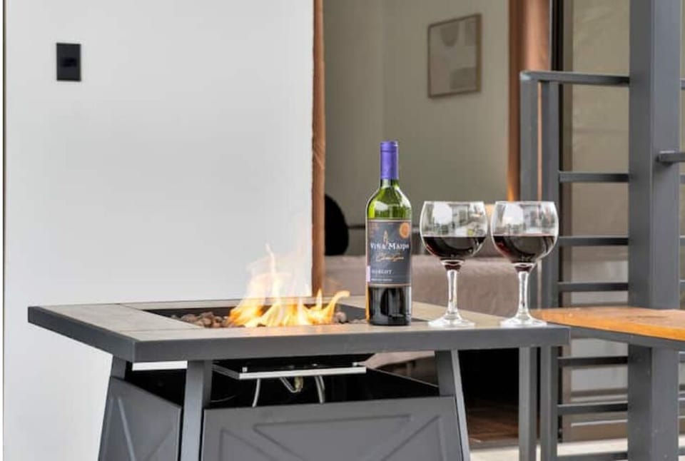 Relax by the fire pit on our terrace, perfect for sunsets.