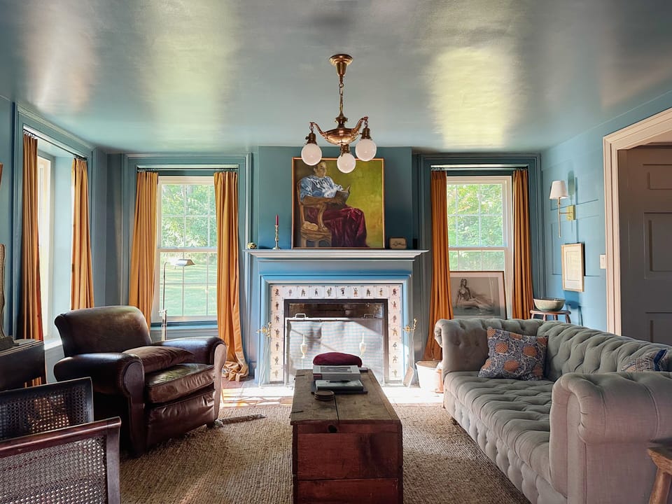 A cozy TV room with a wood burning fireplace!