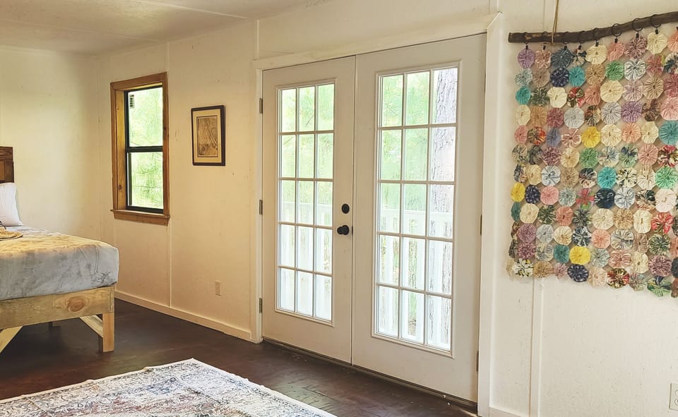 This is a western style bath house master bedroom Balcony doors