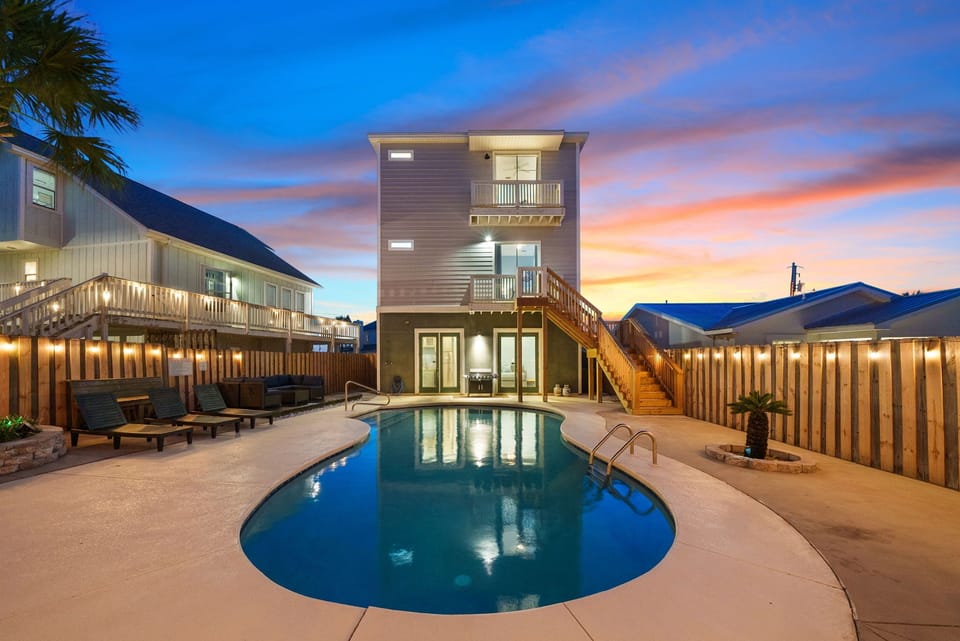 Evenings glow brighter when the pool lights up with string lights all around.
