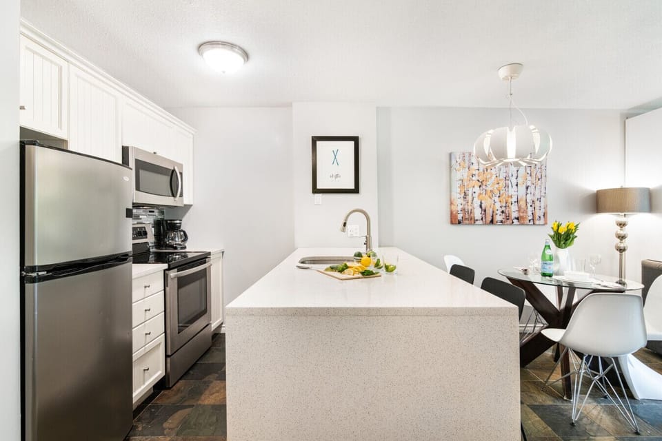 Kitchen island separates kitchen and dining area with extra counter space