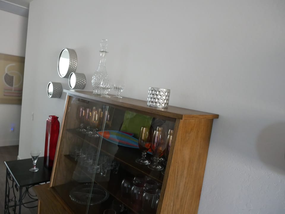 The house is equipped with great mid-century modern furniture, artwork and decor