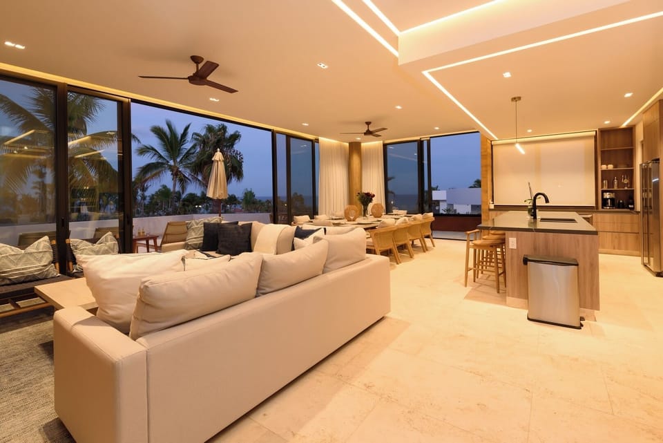 Living room, kitchen, dining room w/ sliders open