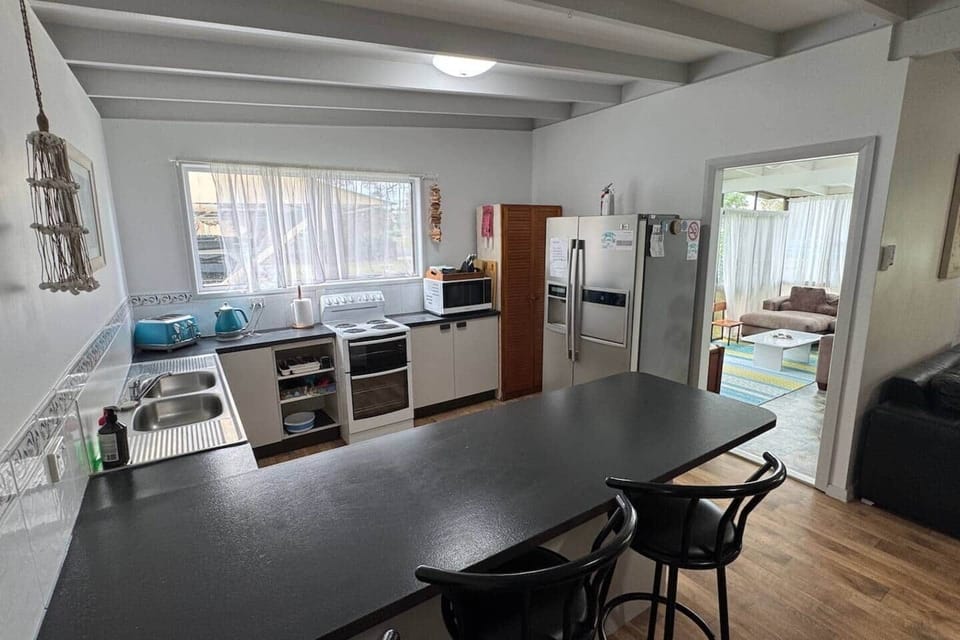 Kitchen leading towards the sunroom.