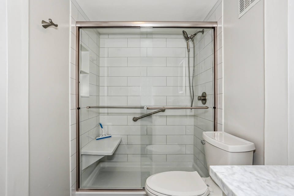 Brand new subway tile shower in the primary bathroom