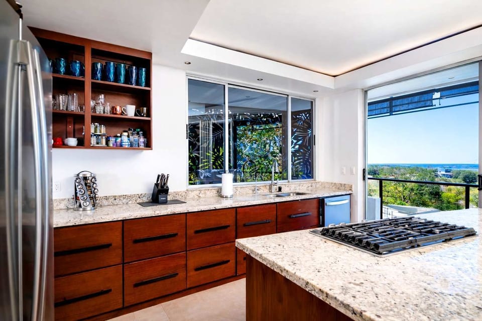 Fully Equipped Gourmet Kitchen with Custom Wood Island, Modern Appliances & Open-Concept Design for Entertaining