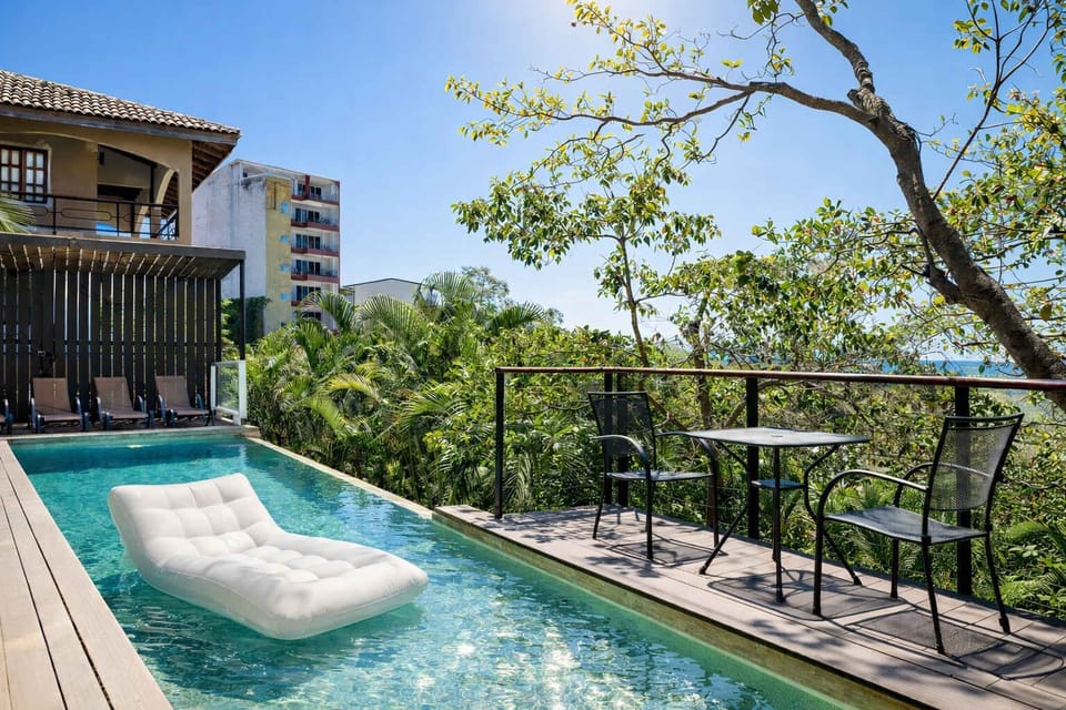 Private Pool with Lounge Seating, Elevated Terrace Dining Area & Lush Tropical Views — Perfect for Relaxing and Enjoying Tamarindo’s Beautiful Weather
