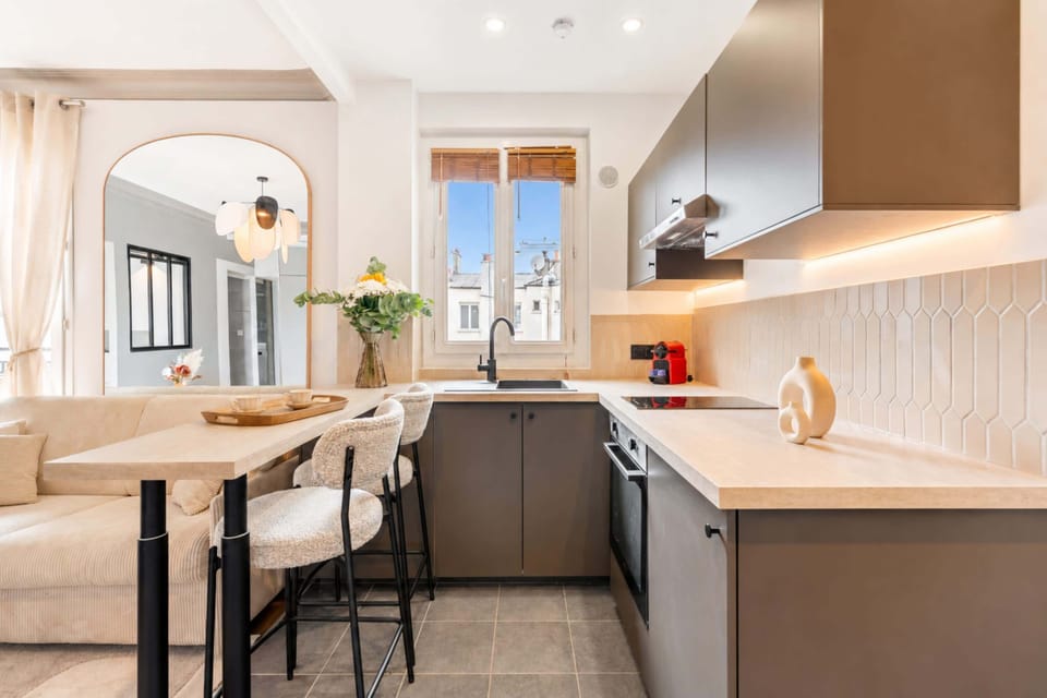 Large counter having a view of the kitchen and living room.