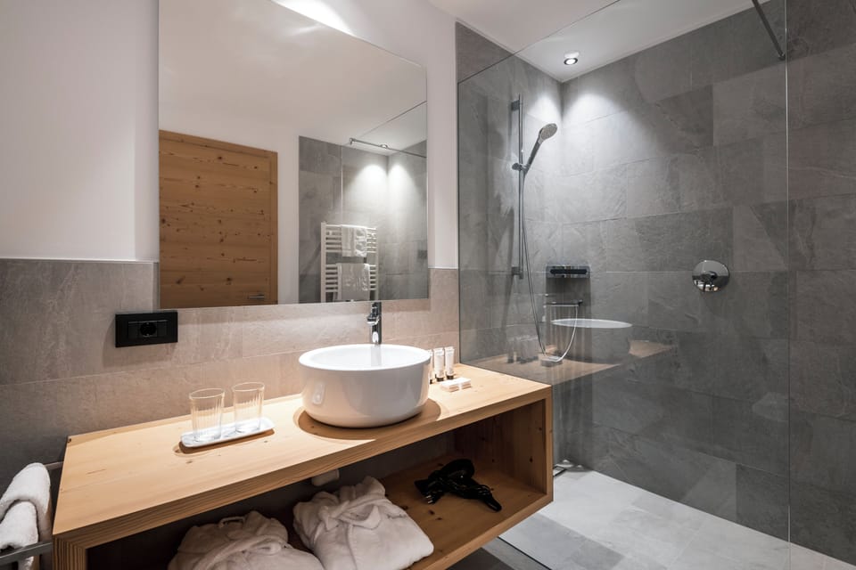 Luxury Quadruple Room, Mountain View | Bathroom | Shower, free toiletries, hair dryer, bathrobes