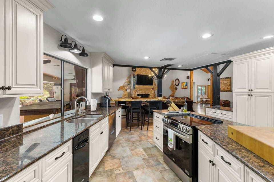 Cook in style with high-end appliances and plenty of cabinetry for all your kitchen essentials—this modern space has it all. 