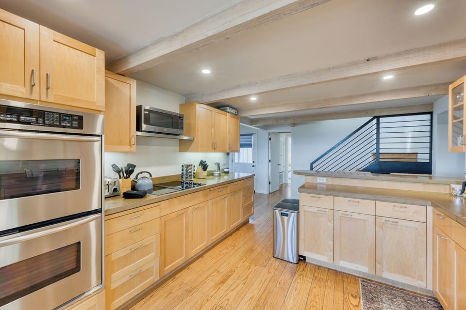 The kitchen equipped with modern appliances.